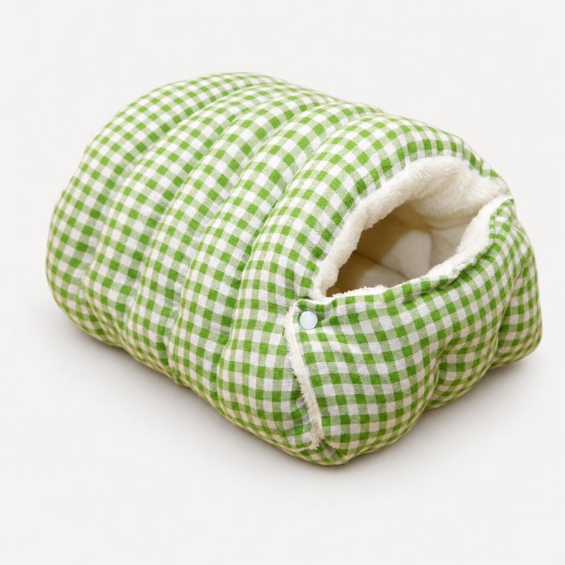 Green plaid Frenchie cave bed with sherpa lining and snap flap