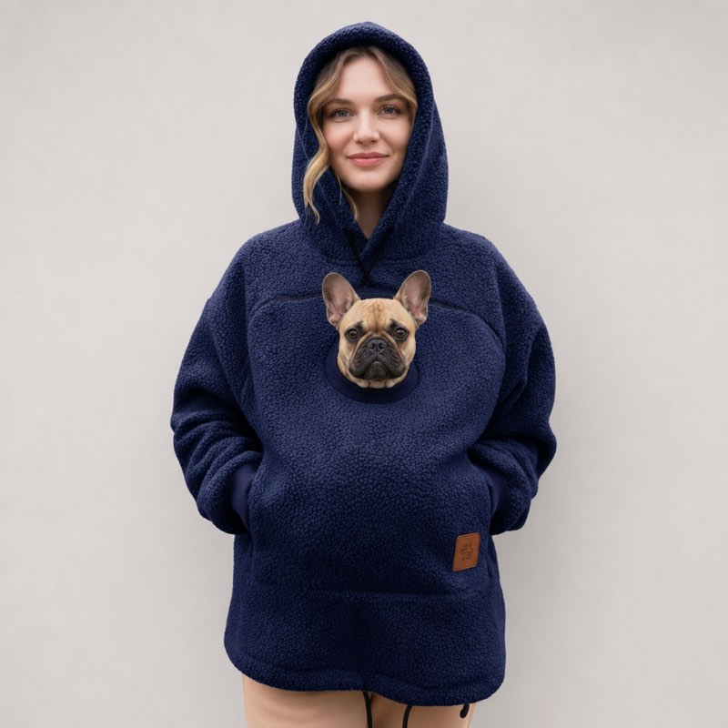 Navy blue Sherpa French Bulldog Carrier Hoodie on a model with a Frenchie peeking out of the pouch