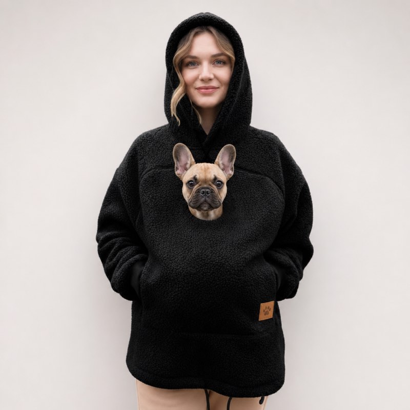 Black Sherpa French Bulldog Carrier Hoodie on a model with a Frenchie peeking out of the pouch
